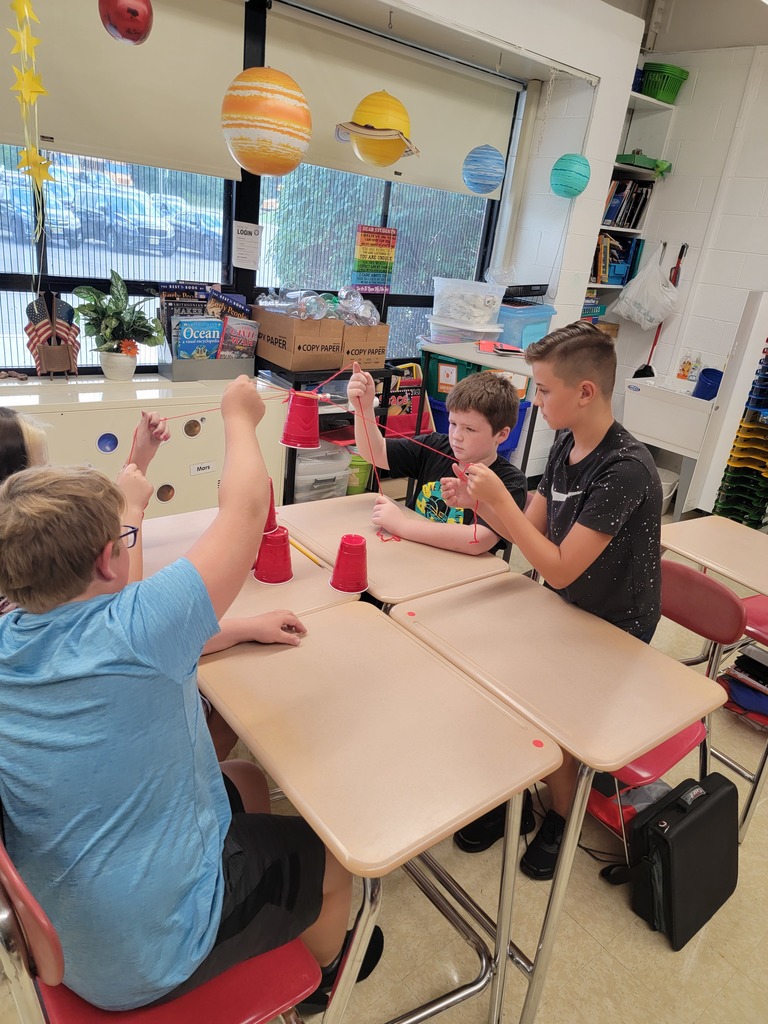 5th graders working together using problem solving techniques.