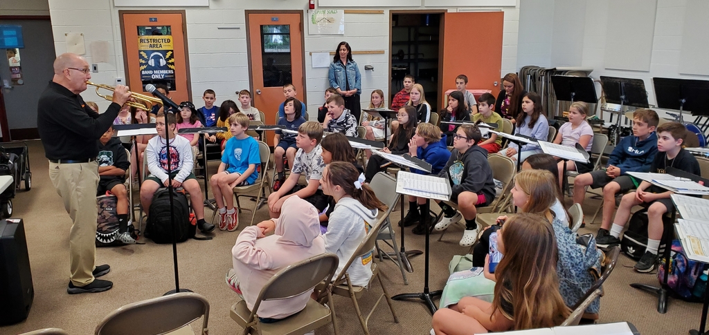 Mr Marino showing off the different instruments students can sign up to play next year.